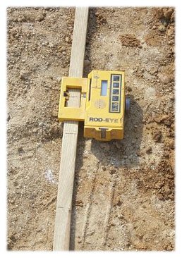 A laser level receiver on a measuring rod