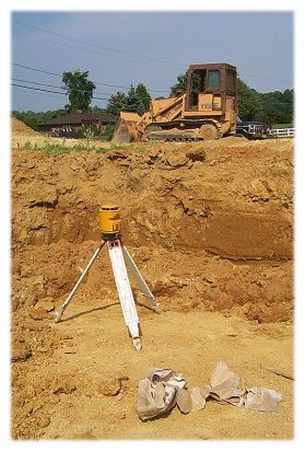 A laser level and a track loader (bulldozer)