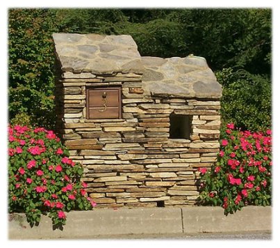 A custom contemporary dry stack stone mailbox