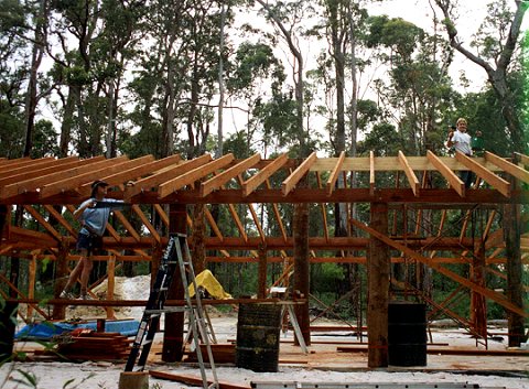 Karri roof rafters are being attached to the ridge board and the rafter tails are being trimmed.