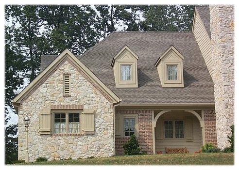 Brick and stone custom home close up