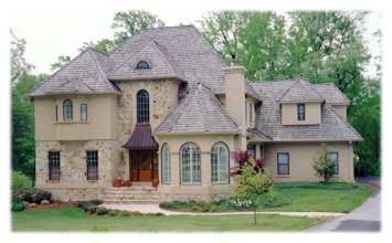 Stone, "Dryvit", and cedar shingles