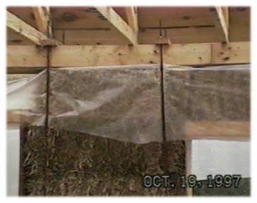 Compression rods for a straw bale house